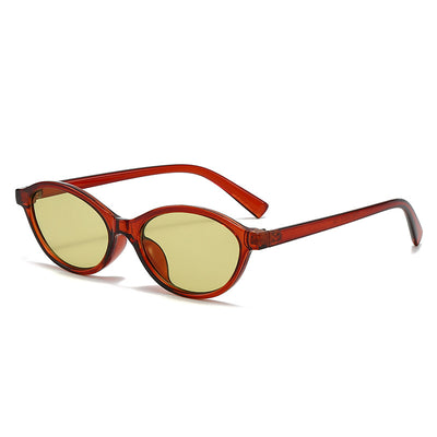 Retro fashion small frame sunglasses with translucent brown frames and yellow oval lenses, viewed from an angle. - Image 10