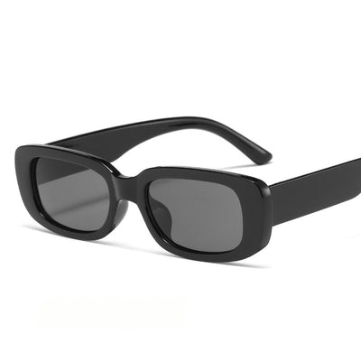 Children's small frame oval sunglasses with a solid white PC frame and brown AC lenses for UV protection. - Image 5