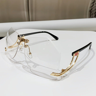 Rimless sunglasses with gradient pink lenses and gold-tone hollow temples, featuring a unique quadrilateral shape. - Image 2