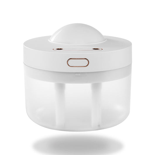White portable projection humidifier with a translucent water tank and gold-accented control buttons. - Image 9