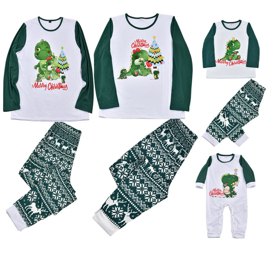 Woman in a Christmas pajama set with a white top, green sleeves, dinosaur graphic, and green fair isle pants. - Image 3