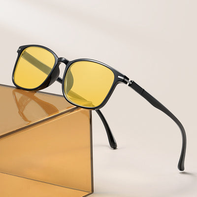 Purple frame glasses with yellow night vision lenses, featuring a subtle glitter effect on the temples.