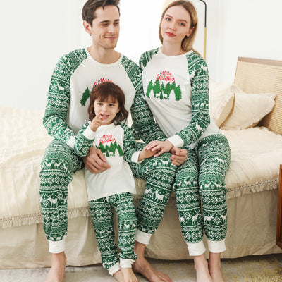 Family of three wearing matching white and green Christmas pajamas with reindeer and "Merry Christmas" text. - Image 4