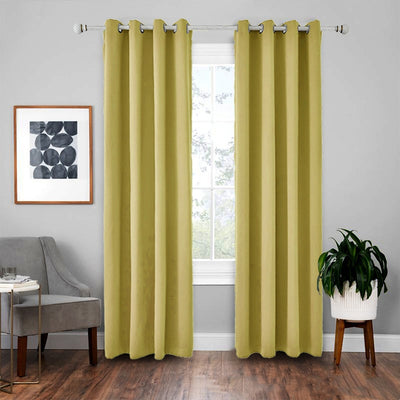 Light gray polyester blackout curtains with grommet tops hanging on a white rod in a modern living room. - Image 8