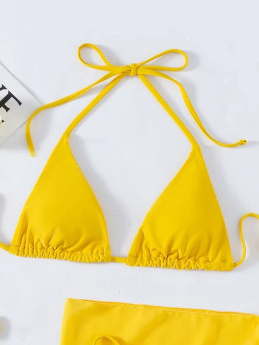 Neon yellow three-piece bikini set with triangle cup lace-up top, tie-side bottom, and matching sarong, displayed with a straw hat and sunglasses. - Image 22
