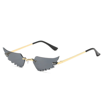 Red angel wings sunglasses with gold metal arms and black earpieces, featuring a unique rimless design. - Image 9