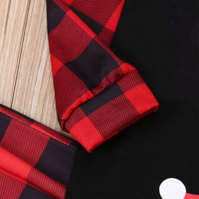 Family matching Christmas pajamas with black tops, red plaid sleeves, and Santa wearing a mask, paired with red plaid pants. - Image 14