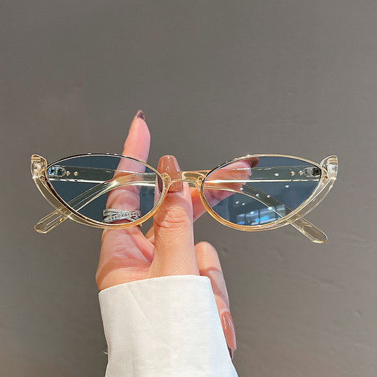 Pink cat-eye sunglasses with purple gradient lenses on a white background, showcasing a trendy style. - Image 2