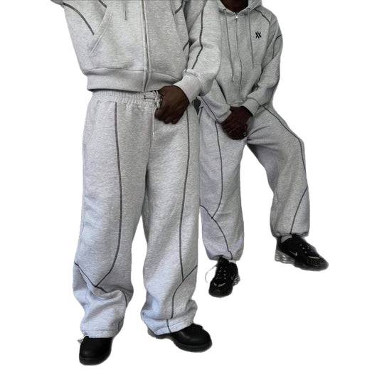 Light gray hooded tracksuit with dark gray contrast stitching, featuring a full-zip hoodie and matching loose sweatpants. - Image 5