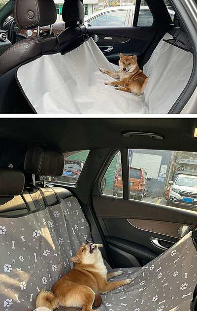 Pink car pet mat with white paw print and bone patterns, featuring black straps for securing to a rear seat. - Image 36