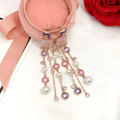 Aretes Estrella de Ocho Puntas Dorados con Diamantes y Borla de Perla - Image 4