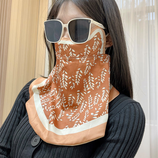 Female cream and black floral polka dot sun protection mask with ear loops, designed for eye corner protection. - Image 48