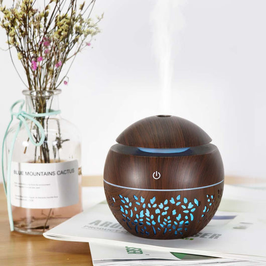 Dark wood grain mini ultrasonic humidifier with a mushroom shape and decorative hollow-out pattern. - Image 2