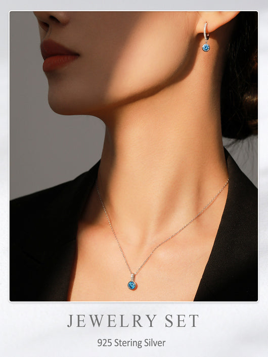 Women's light luxury jewelry set with a silver-toned necklace and hoop earrings, each featuring a sea blue artificial diamond pendant and clear artificial diamo - Image 7