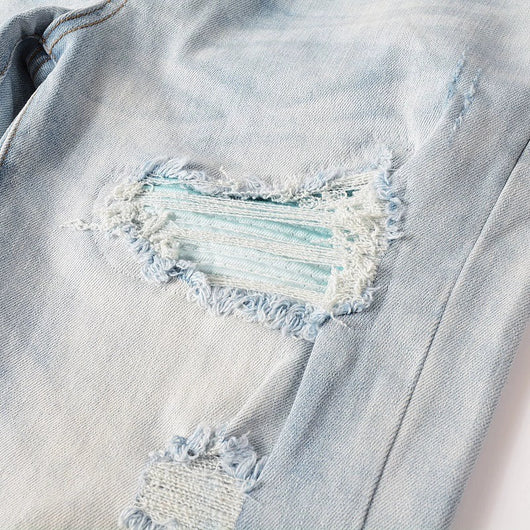 Jeans Azul Cielo Desgastado con Roturas Vintage para Hombre - Image 16