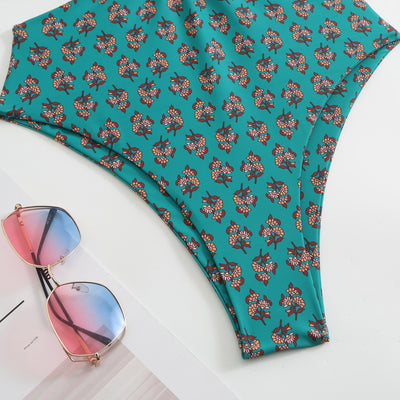 Dark green floral one-piece swimsuit with halter neck, bandeau top, cut-outs, and matching sheer sarong. - Image 22