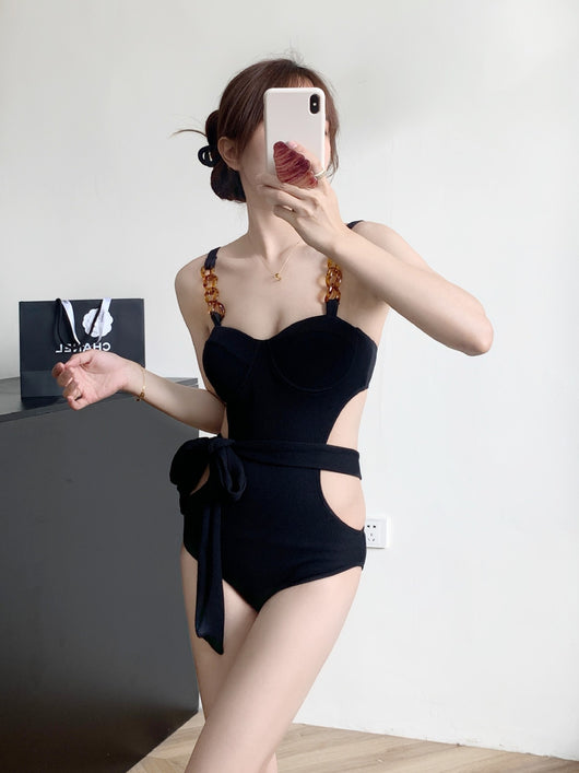 Black ribbed one-piece swimsuit with sweetheart neckline, chain-link shoulder strap, side cut-outs, and self-tie waist. - Image 12