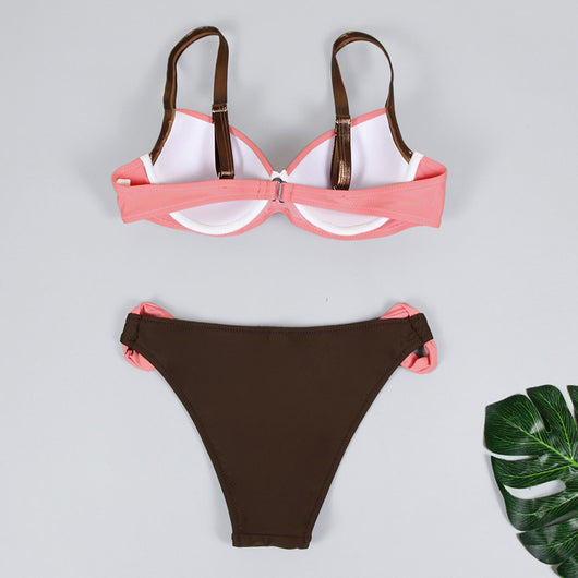 Women's two-piece swimsuit with a pink pleated bandeau top and brown bikini bottoms with pink accents, by the ocean. - Image 24