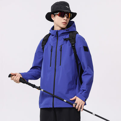 Man wearing a black windproof and waterproof outdoor jacket with a hood, sports sunglasses, and a bucket hat, holding a trekking pole. - Image 4