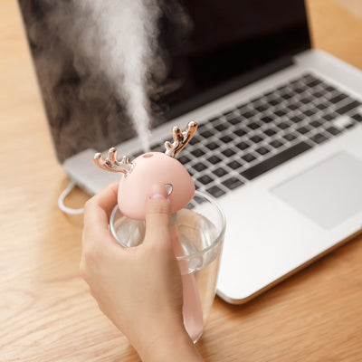 White and clear columnar mini humidifier with a cute bird-shaped top, featuring rose gold beak and tail accents. - Image 3
