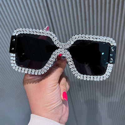 Oversized rectangular sunglasses with black lenses and frames heavily embellished with multiple rows of sparkling rhinestones. - Image 2