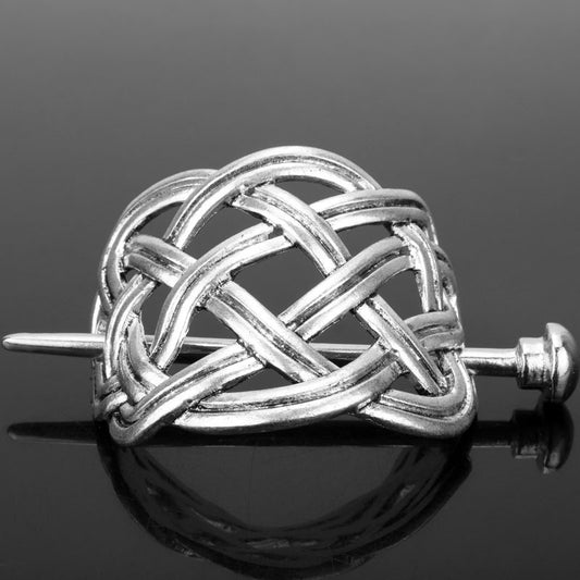 Silver metal hair clip with a retro dragon head and infinity knot design, secured by a plug-in hairpin. - Image 2