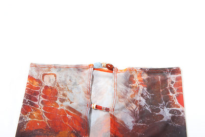 Women's fashionable three-piece bikini set with an abstract orange, brown, and blue print. Features a triangle top, mesh mini skirt, and lace-up details with be - Image 17