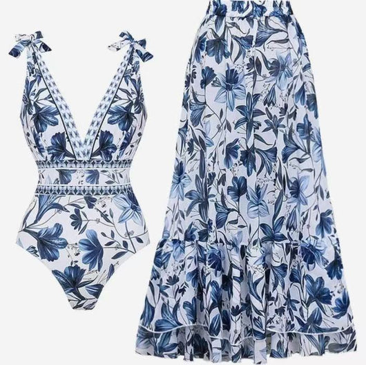 Women's white one-piece swimsuit with deep V-neck, blue floral and geometric patterns, and tie-shoulder straps. - Image 9