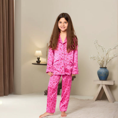 Young girl in a leopard print pajama set with black feather trim on the cuffs and ankles, wearing a pink glitter headband. - Image 4
