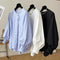 Blusa Suelta con Mangas Plisadas y Detalle de Borlas