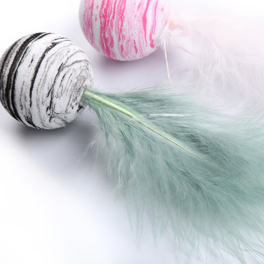 Light blue feather cat toy with a black and white marbled foam ball base on a white background. - Image 10
