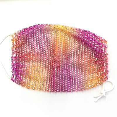 Close-up of a blue mesh fabric adorned with numerous small, clear rhinestones, creating a sparkling texture. - Image 23