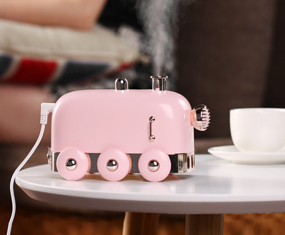 Pink retro mini train ultrasonic humidifier and aroma diffuser with rose gold accents on a white background. - Image 10