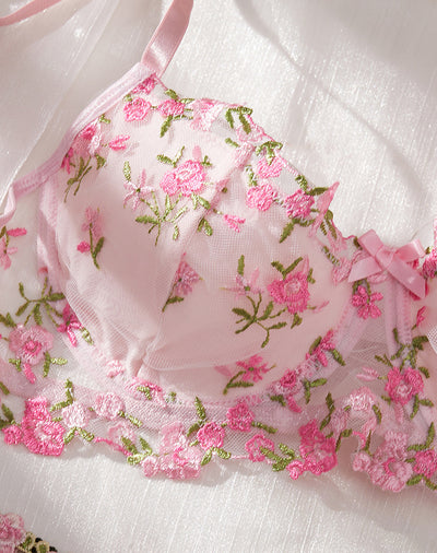 Pink floral embroidered lace lingerie set with bra, garter belt, and thong on a white textured background. - Image 11