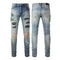 Jeans Slim Fit Azul con Pliegues, Detalles de Piel de Serpiente y Rotos Bordados