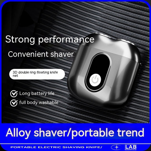Silver mini electric shaver with a double-headed rotary design and a black power button on top. - Image 4