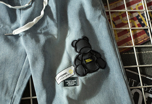 Jeans Vintage Sueltos para Hombre con Estampado de Oso y Letras - Image 12