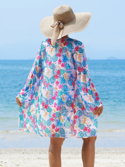 Multicolor tropical print three-piece swimsuit set with high-waisted bikini and sheer mesh cover-up on a beach. - Image 16