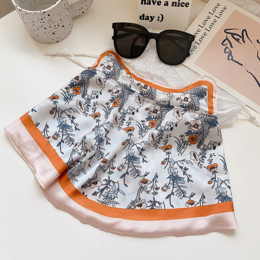 Female cream and black floral polka dot sun protection mask with ear loops, designed for eye corner protection. - Image 45
