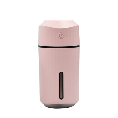 Pink columnar mini car humidifier with a power button and a clear water level indicator on a white background. - Image 7