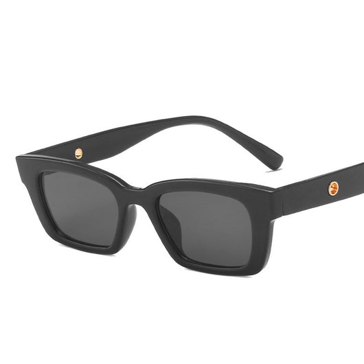 Transparent gray frame sunglasses with dark gray rectangular lenses and small gold accents on the temples. - Image 10