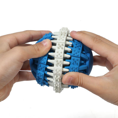 Orange and white rubber pet toy ball with textured surface for teeth cleaning and food dispensing.