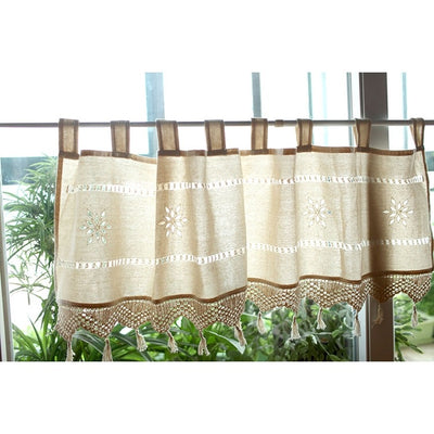 Beige cotton linen cafe curtain with tab tops, snowflake embroidery, and brown crochet trim with tassels. - Image 6