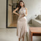 Conjunto Elegante: Blusa Sin Mangas Estampada y Falda Tableada con Abertura