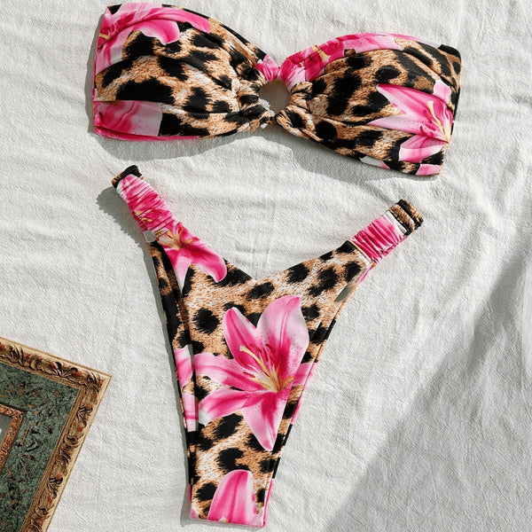 Women's tube top bikini swimsuit with a pink floral and leopard print, featuring a twisted front top and high-cut ruched bottom.