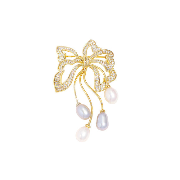 Broche de Perla Dulce Agua con Moño Elegante