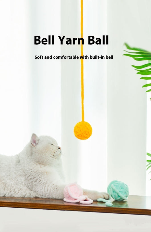 Colorful plush yarn ball cat toy in pink, blue, and white, with a long trailing strand, on a light background. - Image 27