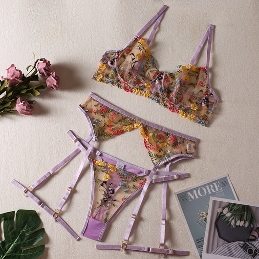 Yellow sheer floral embroidered lingerie set with a bra, thong, and two leg rings, laid flat. - Image 11