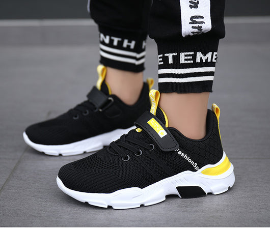 Boy's black and blue sports shoes with orange accents, mesh upper, white sole, blue laces, and a Velcro strap. - Image 19