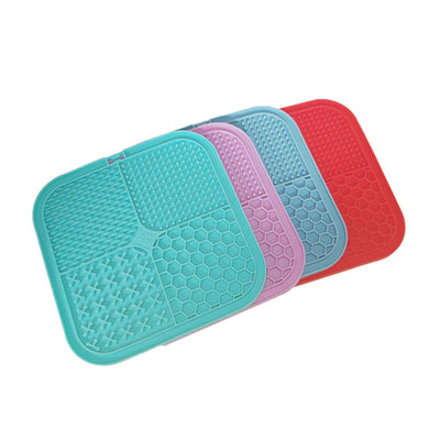 Gray silicone pet licking pad with four textured sections, designed for slow feeding and anti-choking. - Image 47